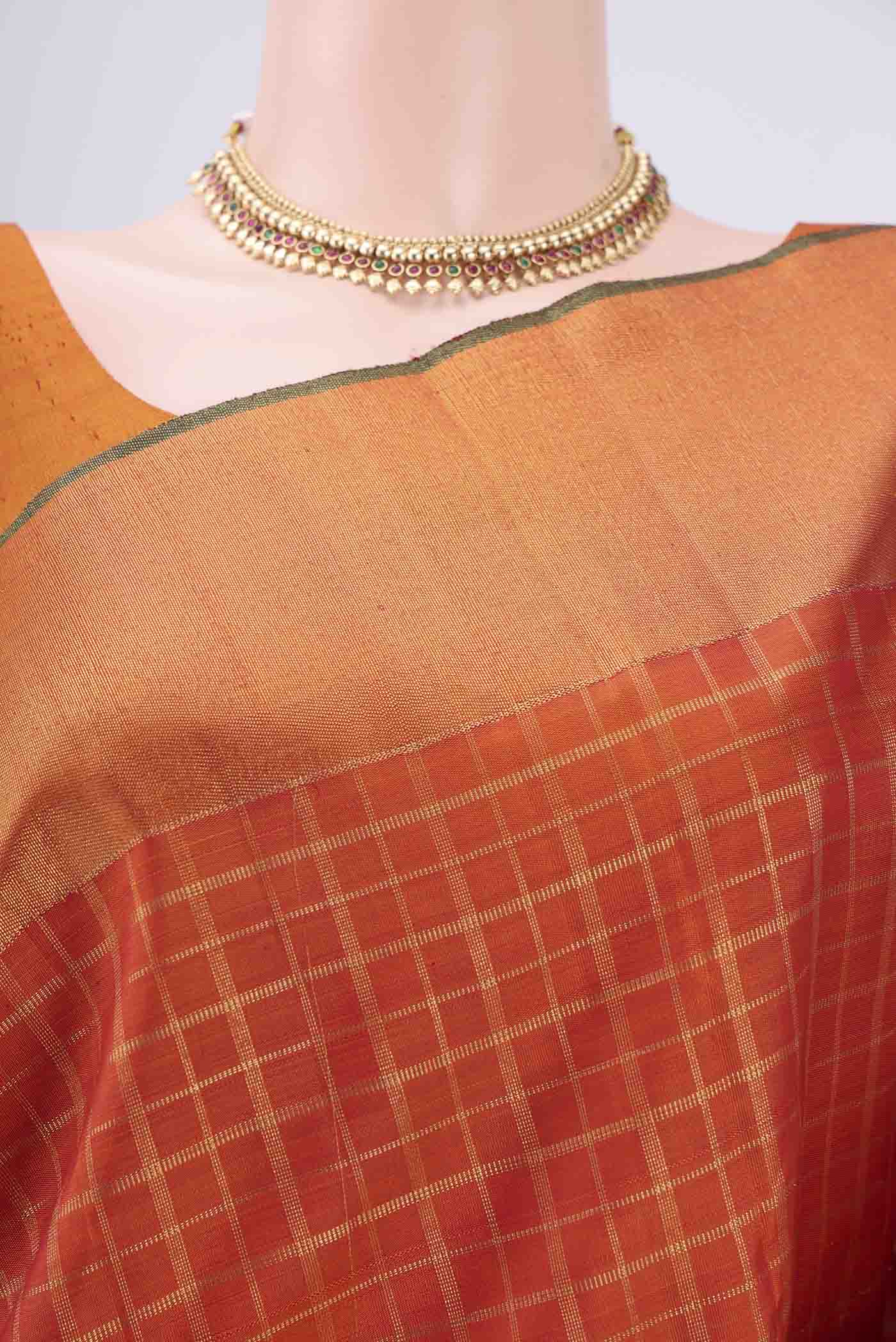 Border image of Pure Silk Pure Zari Rust Kanjivaram Saree with Checked design on the body and Zari Border. 
