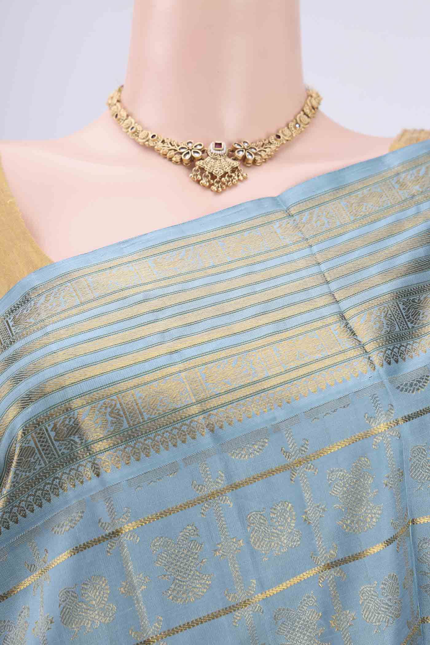 Border image of Pure Silk Pure Zari Light Blue Kanchipuram Saree with Zari Brocade on the body and Zari Border. 