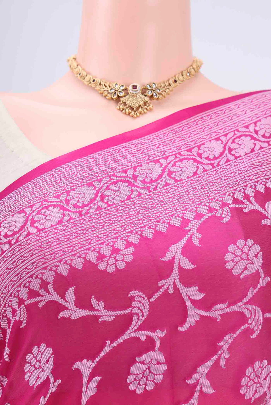 Border image of Rani Pink Blended Banarasi Georgette Saree with Thread Brocade on the body and Zari Border. 