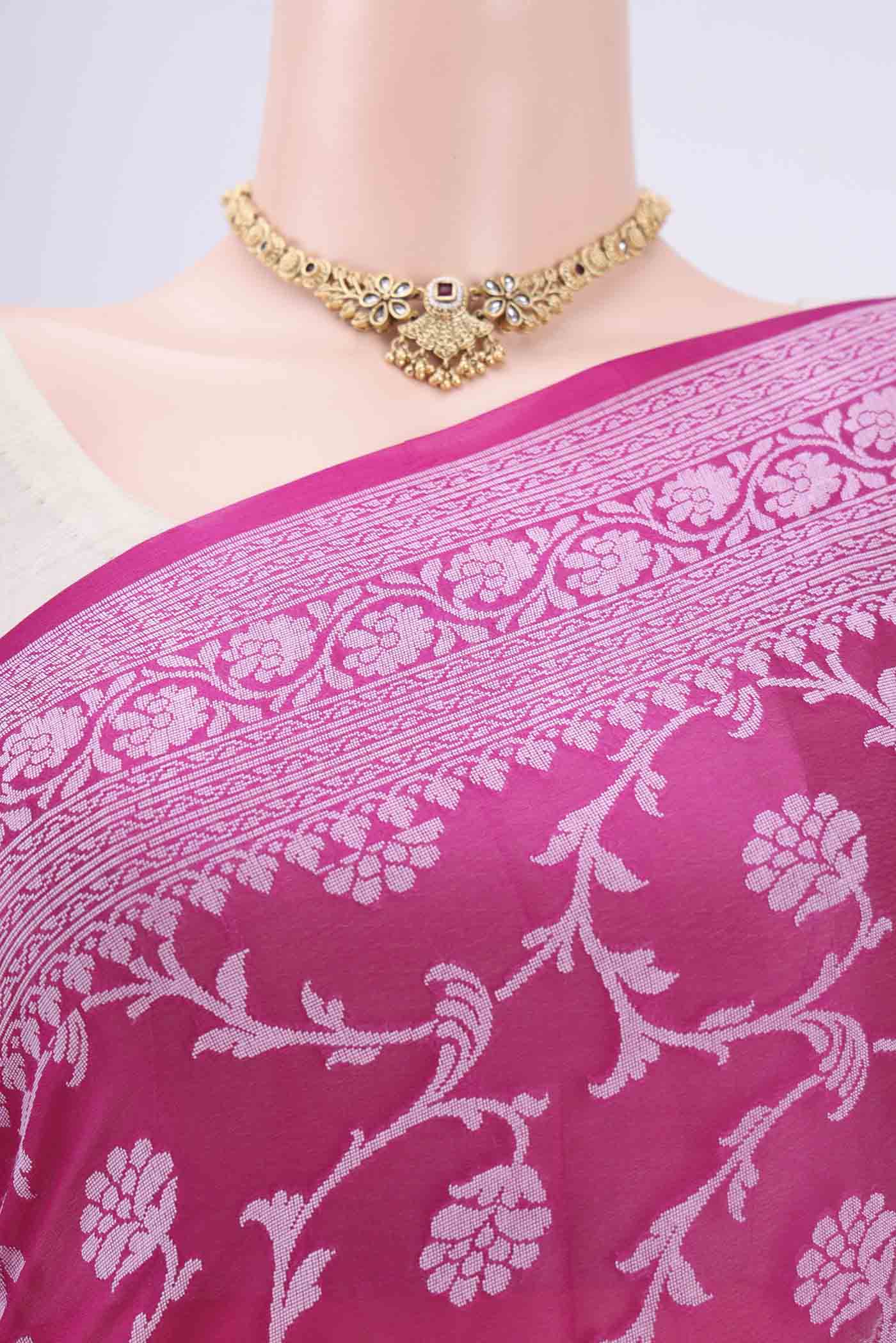 Border image of Rani Pink Blended Banarasi Georgette Saree with Thread Brocade on the body and Zari Border. 