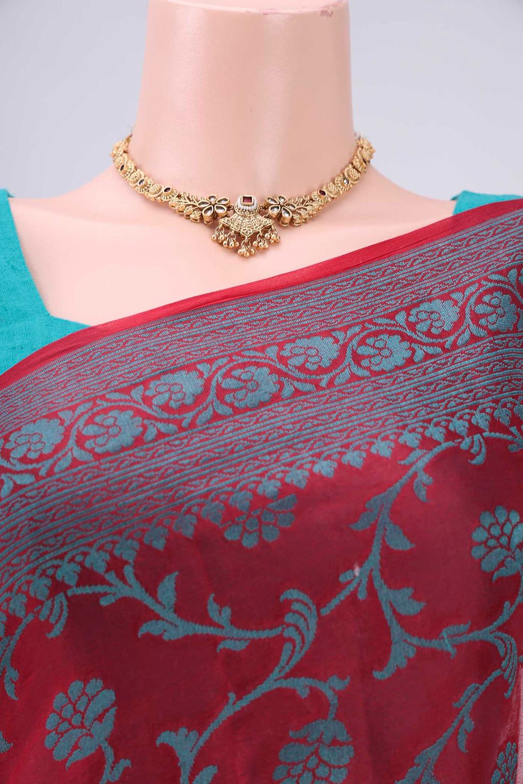 Border image of Red Blended Banarasi Georgette Saree with Thread Brocade on the body and Zari Border. 