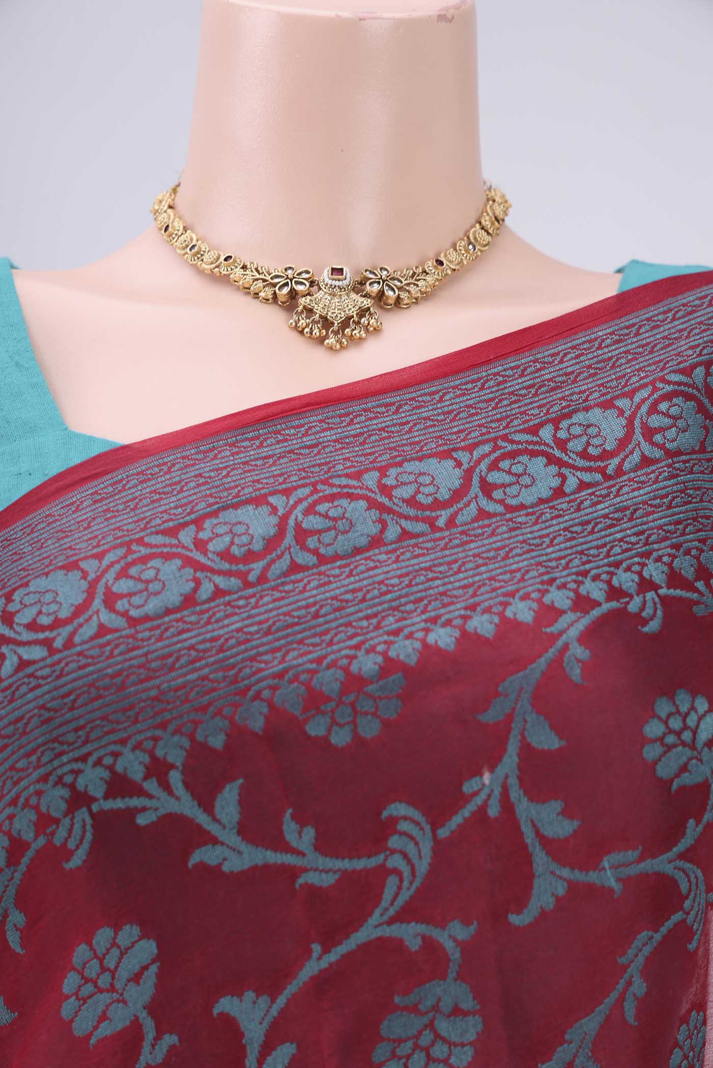 Border image of Red Blended Banarasi Georgette Saree with Thread Brocade on the body and Zari Border. 