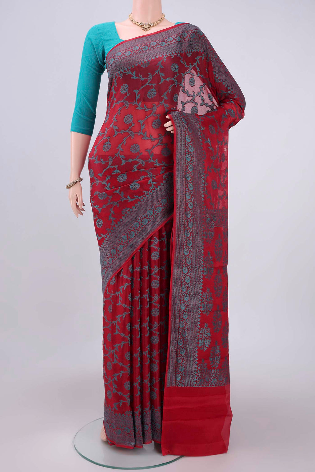 Red Blended Banarasi Georgette Saree with Thread Brocade on the body and Zari Border.  displayed on a mannequin