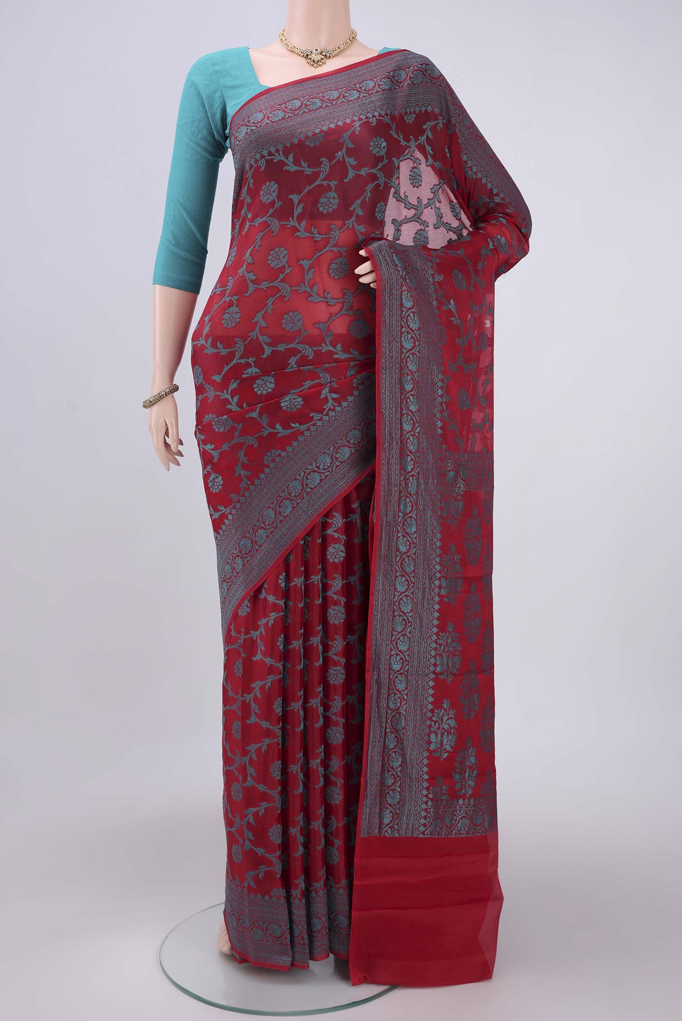 Red Blended Banarasi Georgette Saree with Thread Brocade on the body and Zari Border.  displayed on a mannequin