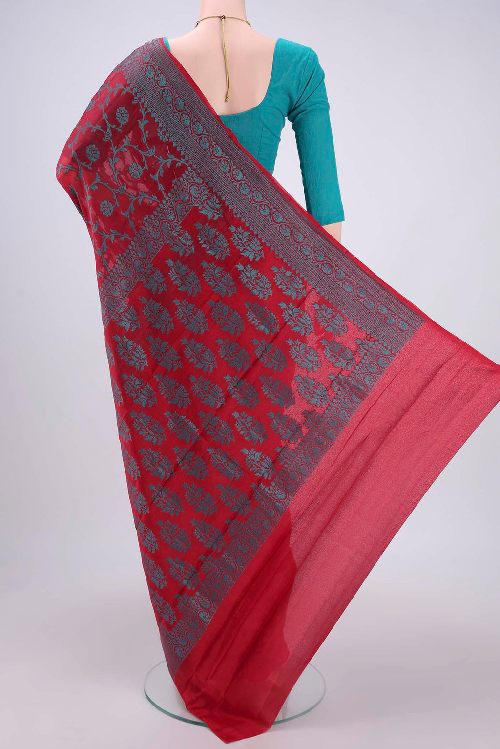 Flat view of Red Blended Banarasi Georgette Saree with Thread Brocade on the body and Zari Border. 