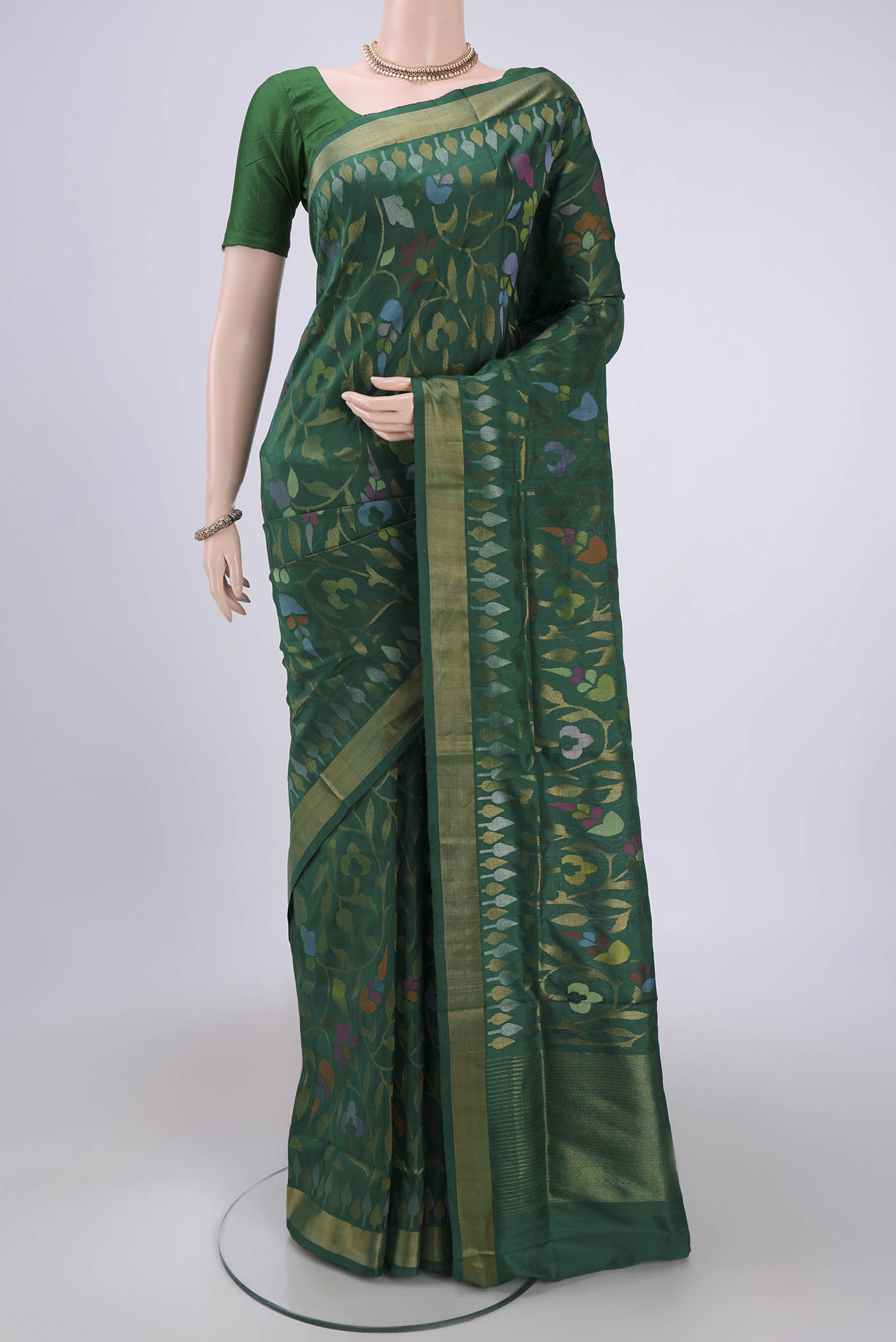 Green Uppada Silk Saree with Jamdani on the body and Zari Border.  displayed on a mannequin