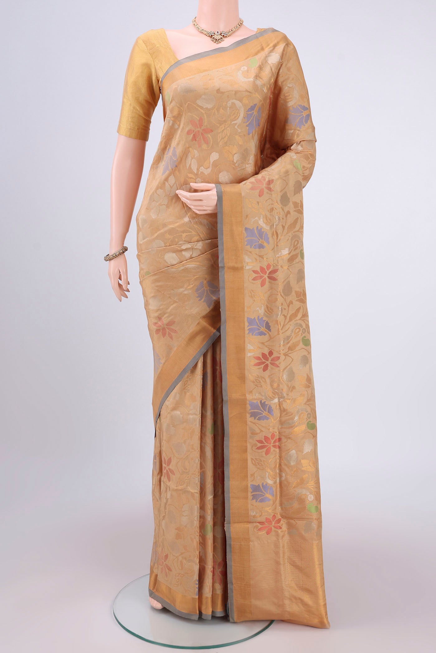 Beige Uppada Silk Saree with Jamdani on the body and Zari Border.  displayed on a mannequin