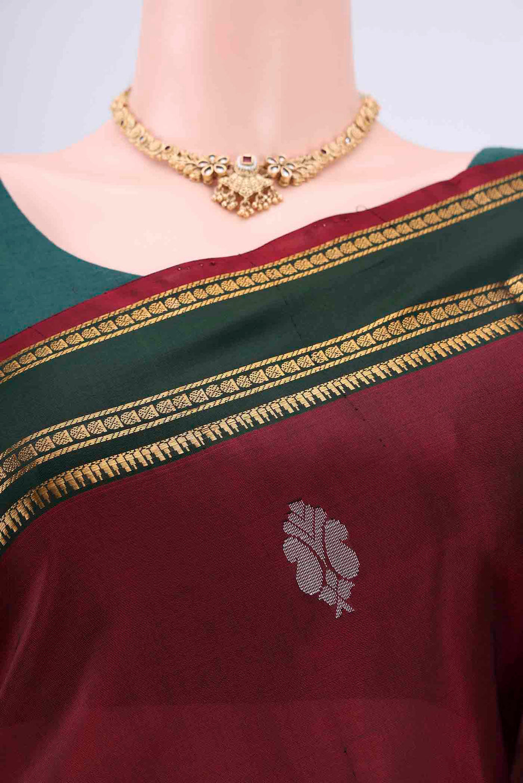 Border image of Maroon Uppada Silk Saree with Zari Butta on the body and Zari Border. 
