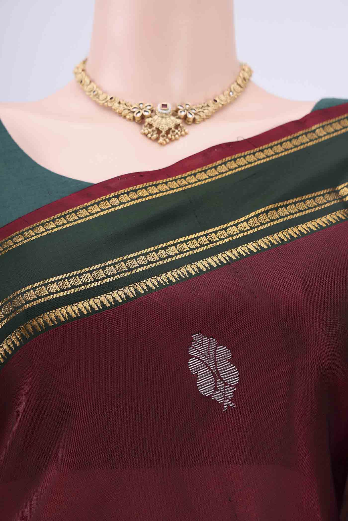 Border image of Maroon Uppada Silk Saree with Zari Butta on the body and Zari Border. 