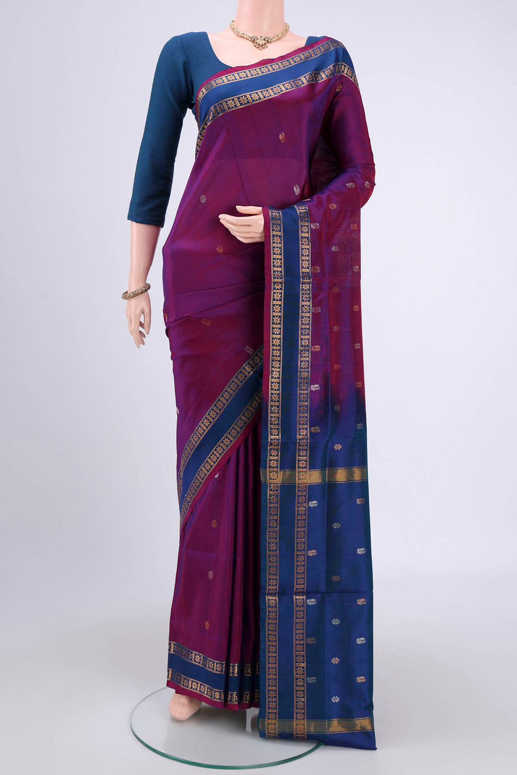Magenta Dual Tone Uppada Silk Saree with Zari Butta on the body and Zari Border.  displayed on a mannequin