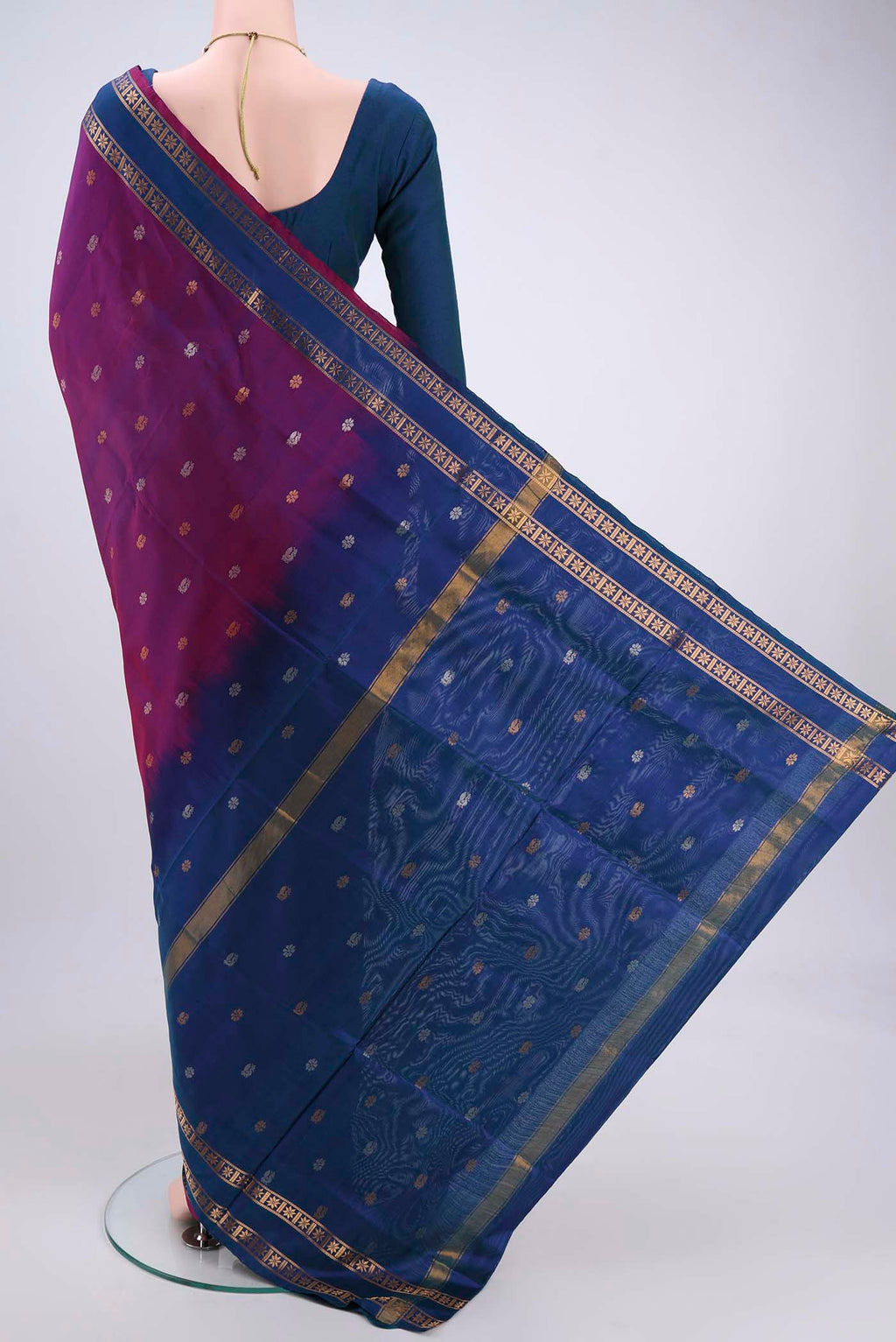 Flat view of Magenta Dual Tone Uppada Silk Saree with Zari Butta on the body and Zari Border. 