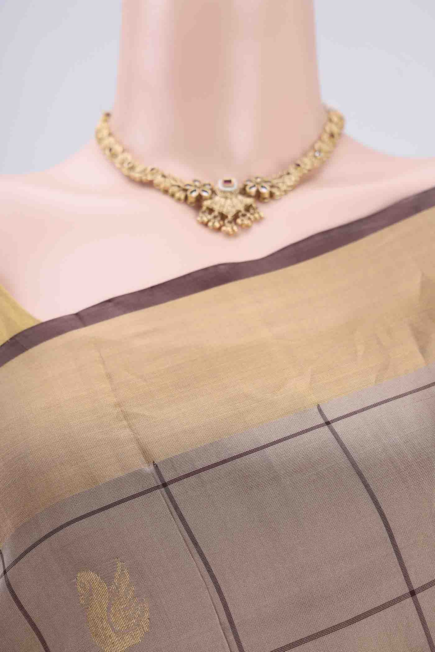 Border image of Dark Beige Uppada Silk Saree with Checked design on the body and Zari Border. 