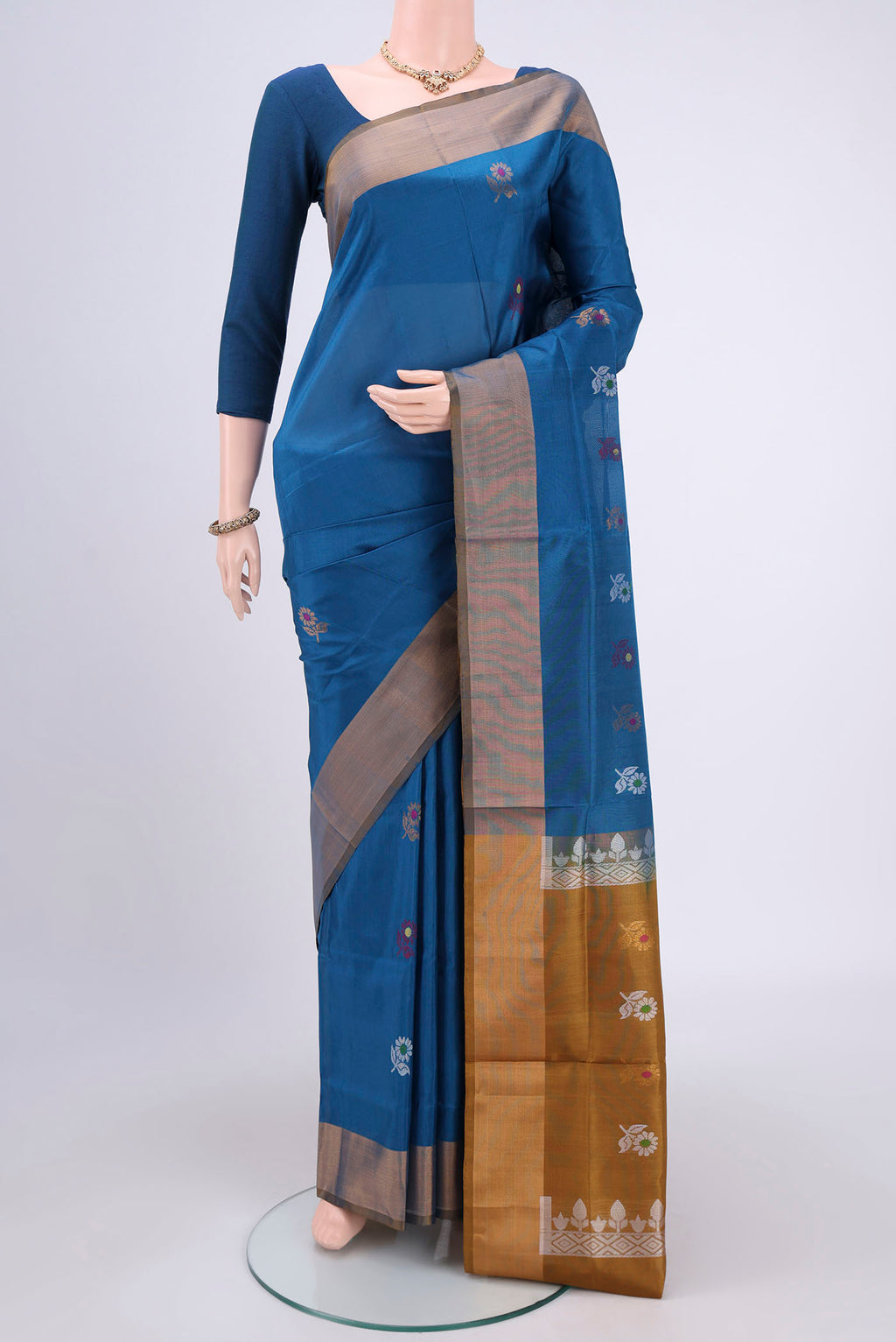 Blue Dual Tone Uppada Silk Saree with Zari And Thread Butta on the body and Zari Border.  displayed on a mannequin