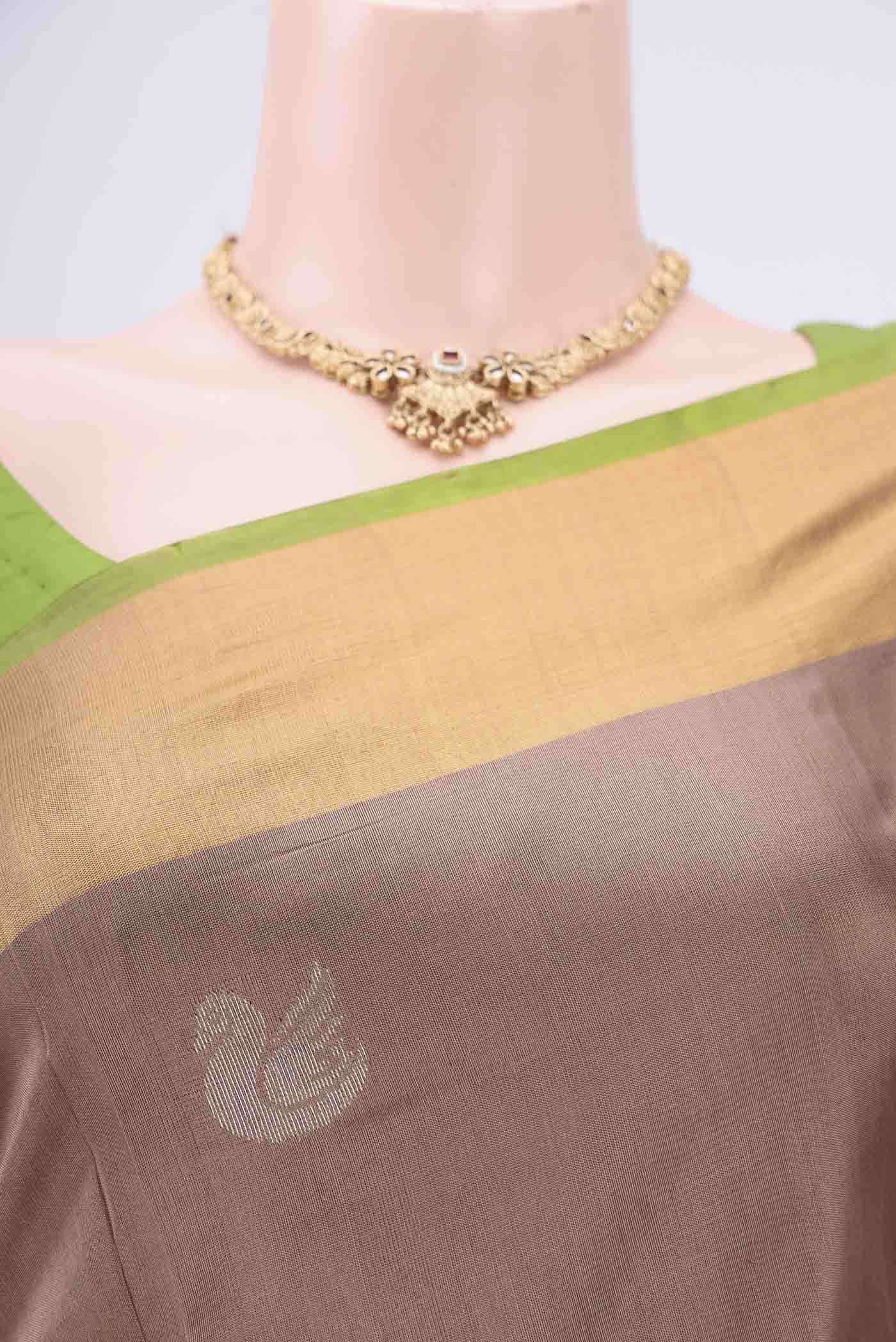 Border image of Brown Uppada Silk Saree with Zari Butta on the body and Zari Border. 