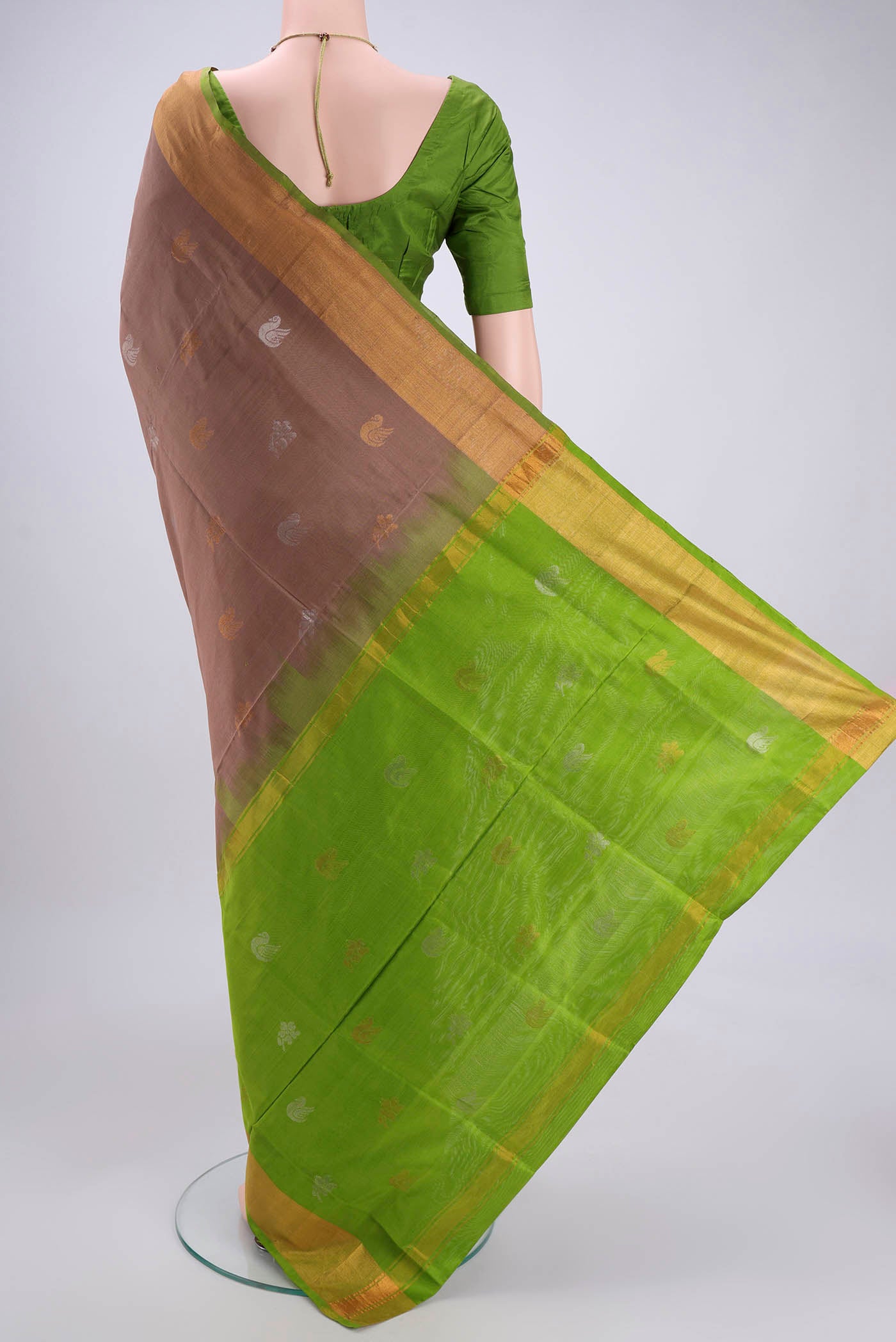 Flat view of Brown Uppada Silk Saree with Zari Butta on the body and Zari Border. 