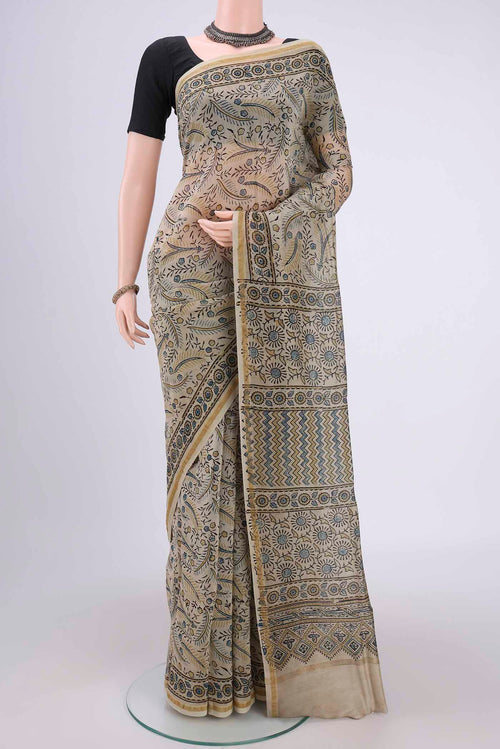 Beige Chanderi Silk Cotton Saree with Ajrakh Print on the body and Zari Border.  displayed on a mannequin