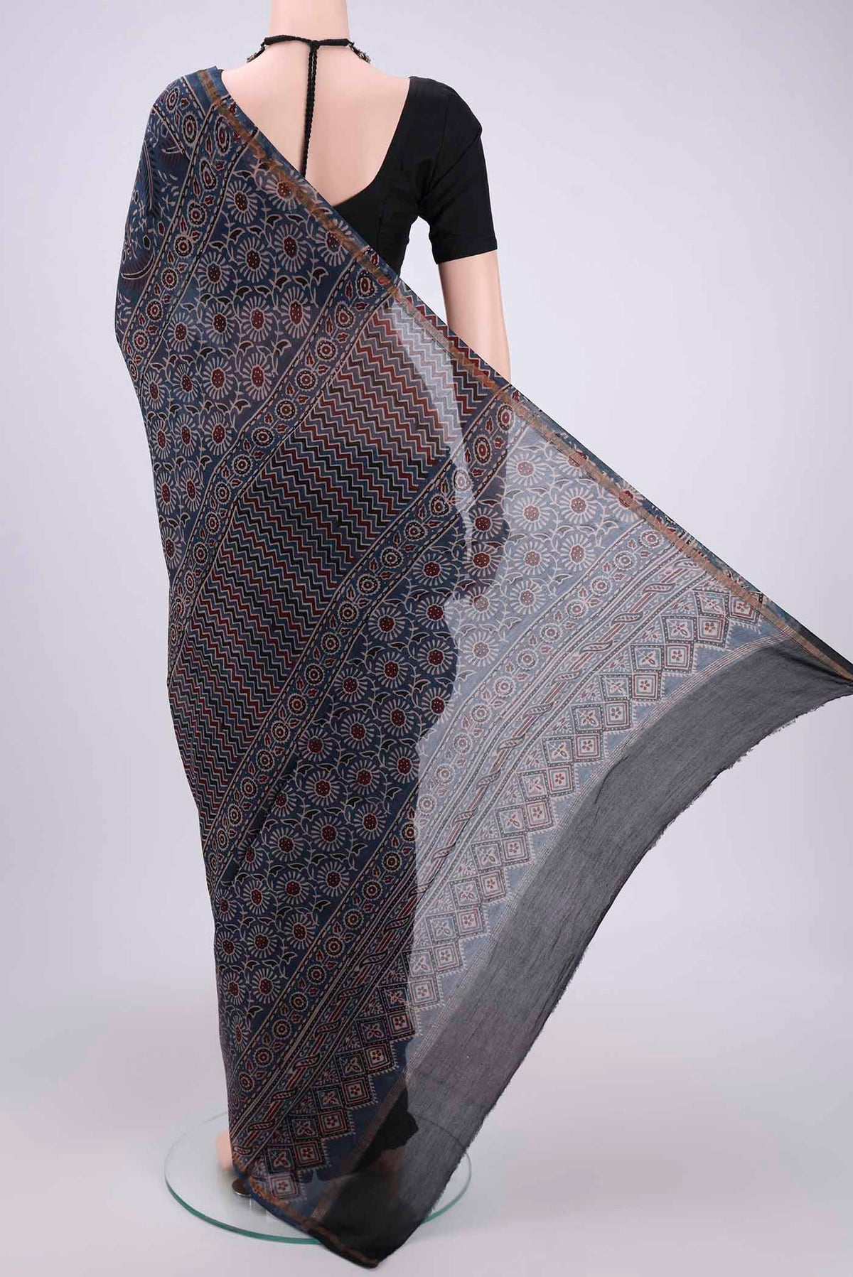 Flat view of Indigo Chanderi Silk Cotton Saree with Ajrakh Print on the body and Zari Border. 