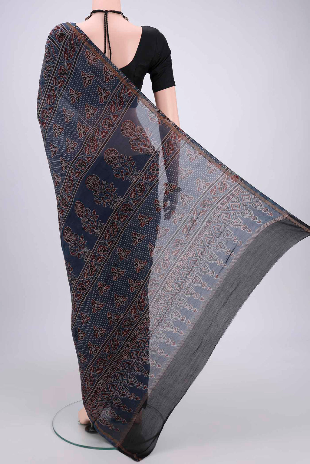 Flat view of Blue Chanderi Silk Cotton Saree with Ajrakh Print on the body and Zari Border. 