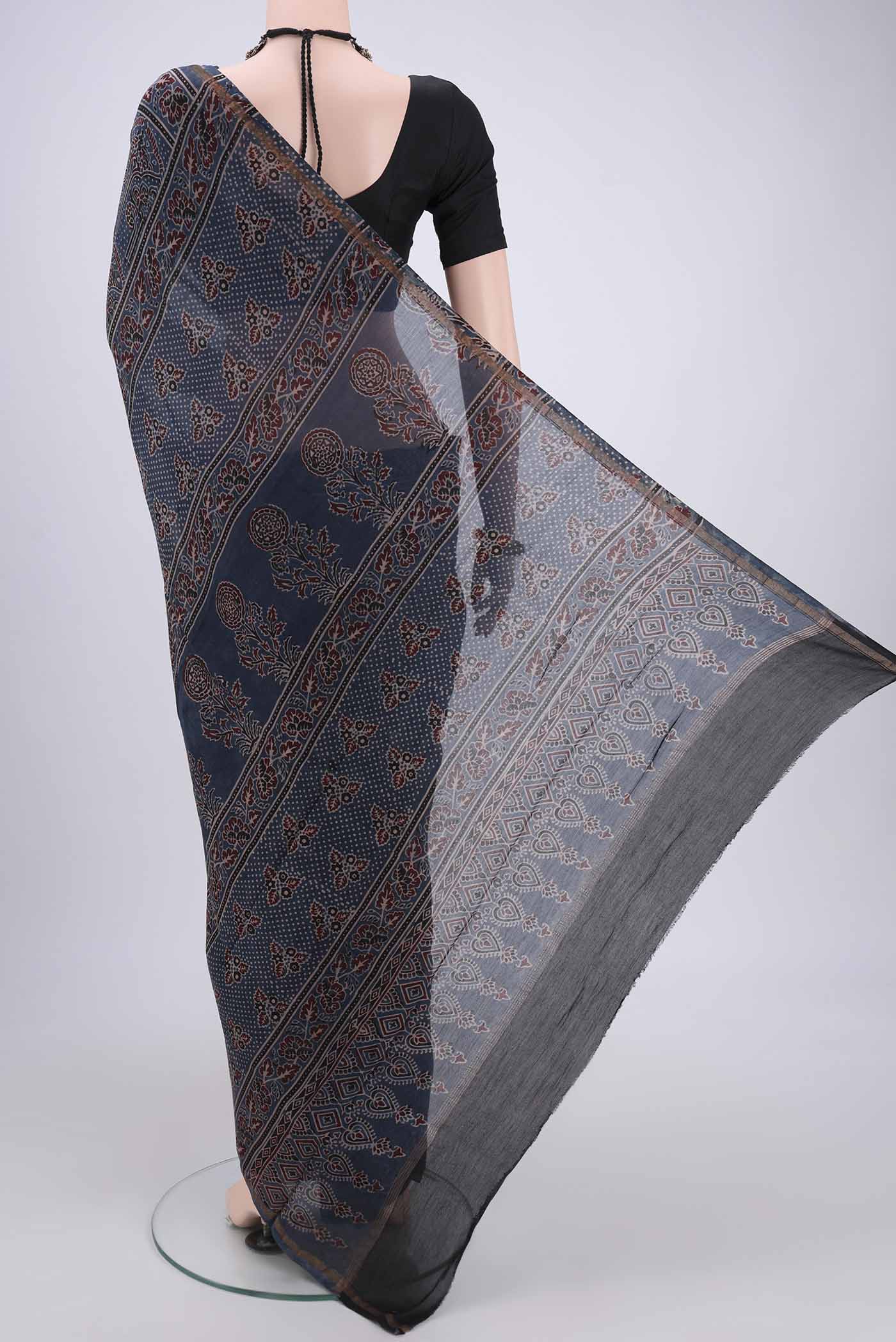 Flat view of Blue Chanderi Silk Cotton Saree with Ajrakh Print on the body and Zari Border. 