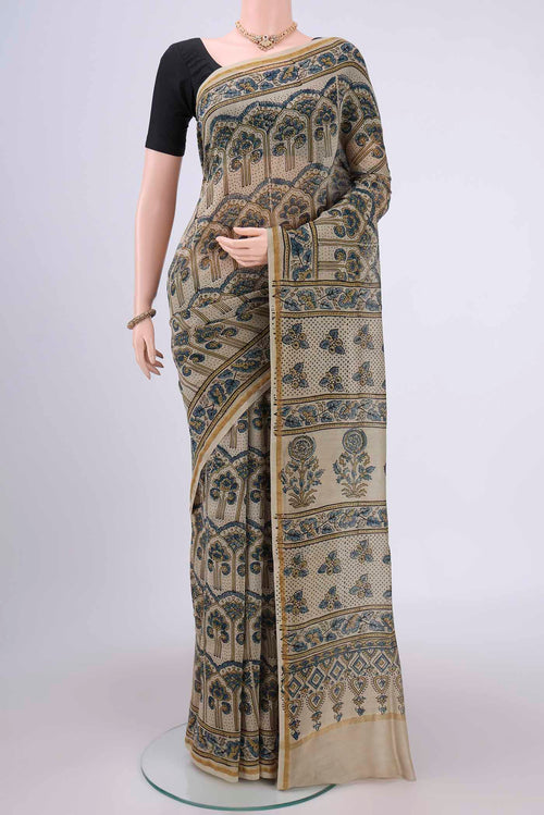Beige Chanderi Silk Cotton Saree with Ajrakh Print on the body and Zari Border.  displayed on a mannequin