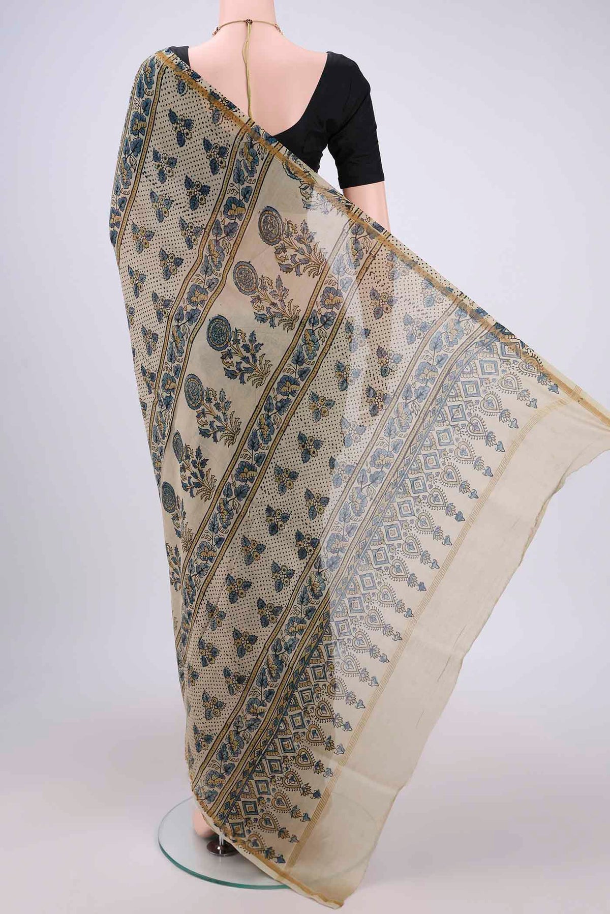 Flat view of Beige Chanderi Silk Cotton Saree with Ajrakh Print on the body and Zari Border. 