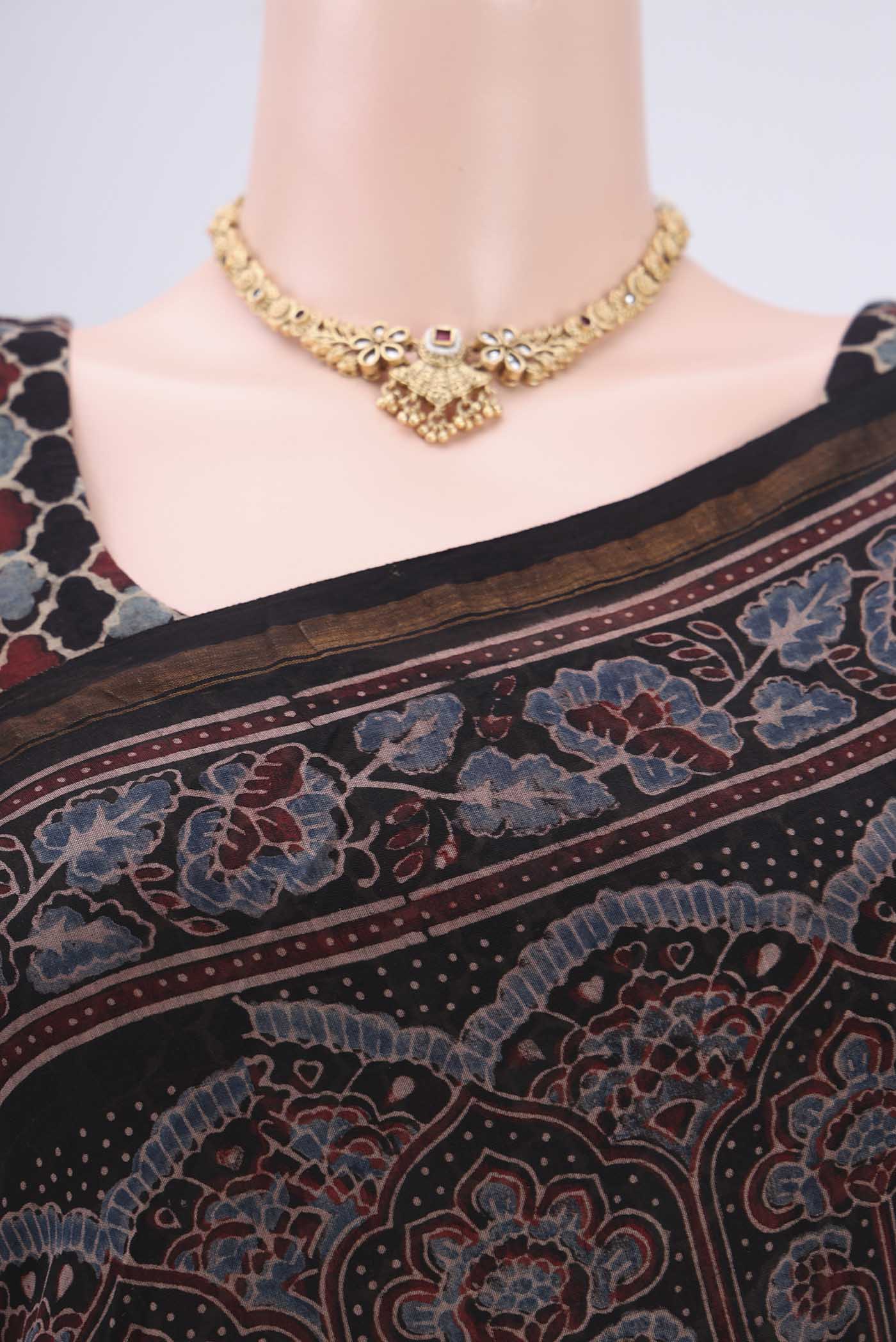 Border image of Black Chanderi Silk Cotton Saree with Ajrakh Print on the body and Zari Border. 