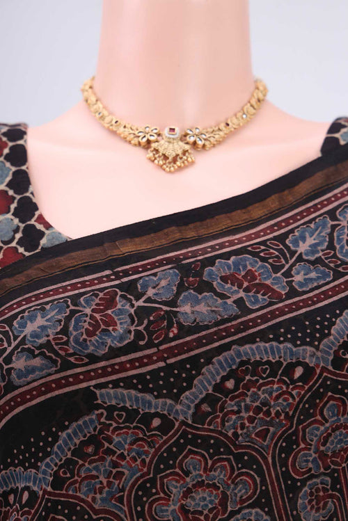 Border image of Black Chanderi Silk Cotton Saree with Ajrakh Print on the body and Zari Border. 