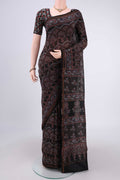 Black Chanderi Silk Cotton Saree with Ajrakh Print on the body and Zari Border.  displayed on a mannequin