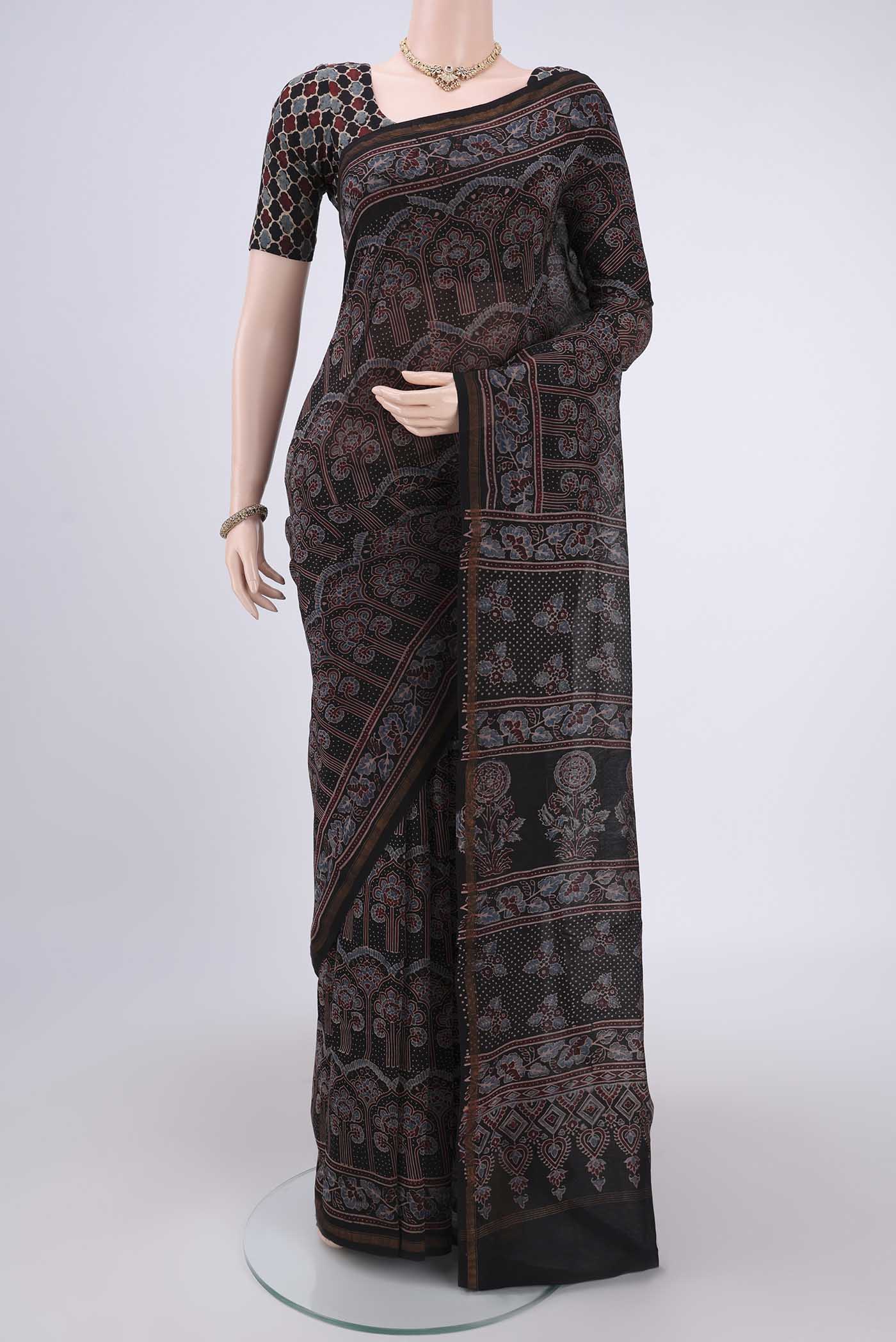 Black Chanderi Silk Cotton Saree with Ajrakh Print on the body and Zari Border.  displayed on a mannequin
