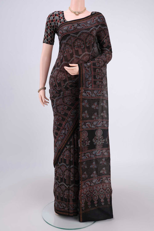 Black Chanderi Silk Cotton Saree with Ajrakh Print on the body and Zari Border.  displayed on a mannequin