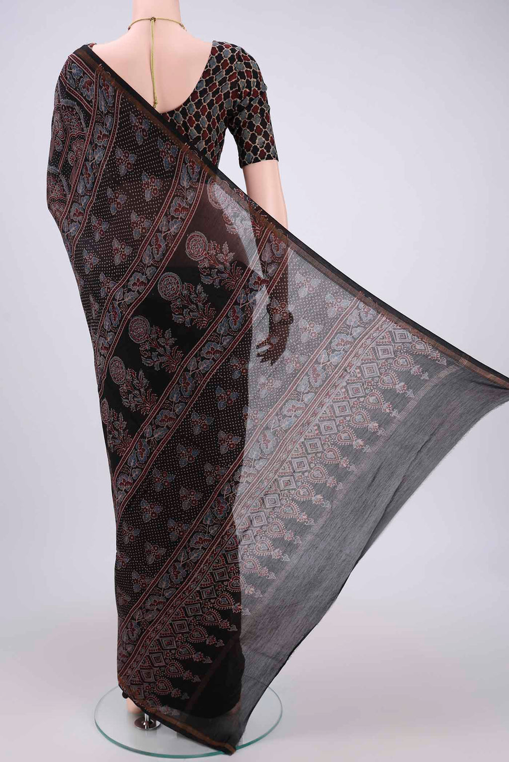 Flat view of Black Chanderi Silk Cotton Saree with Ajrakh Print on the body and Zari Border. 