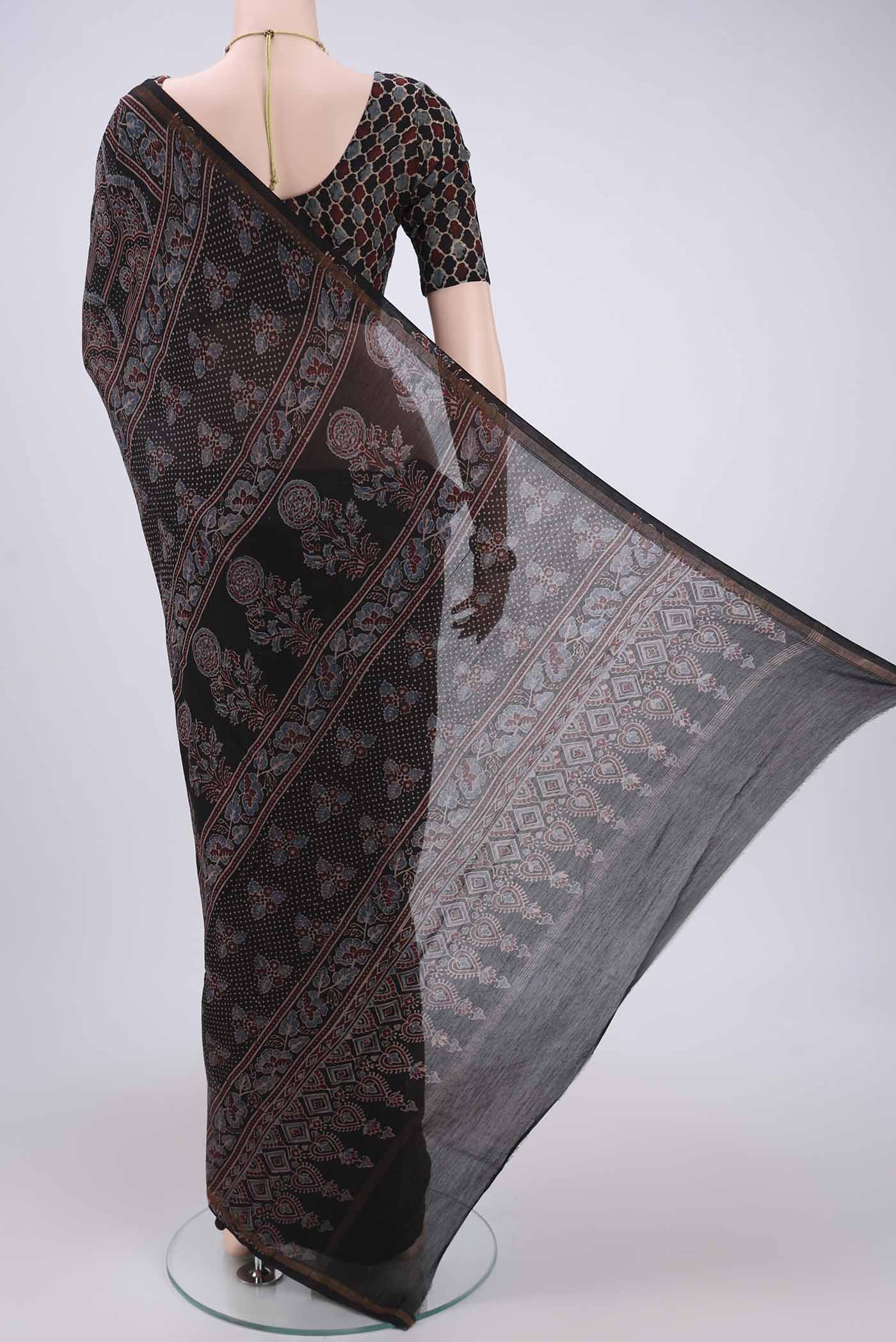 Flat view of Black Chanderi Silk Cotton Saree with Ajrakh Print on the body and Zari Border. 