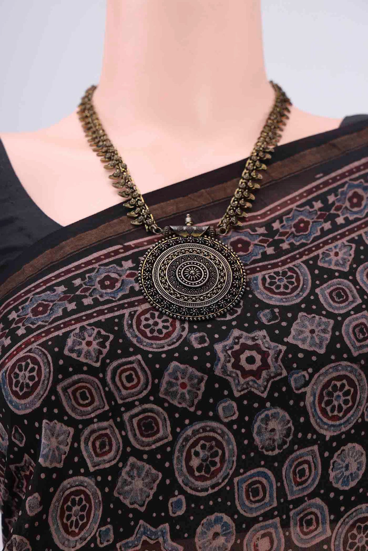 Border image of Black Chanderi Silk Cotton Saree with Ajrakh Print on the body and Zari Border. 