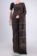 Black Chanderi Silk Cotton Saree with Ajrakh Print on the body and Zari Border.  displayed on a mannequin