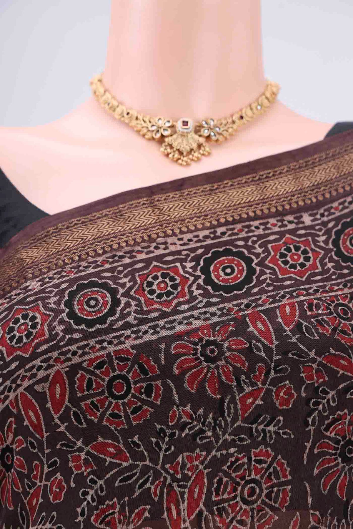 Border image of Black Chanderi Silk Cotton Saree with Ajrakh Print on the body and Zari Border. 