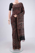 Black Chanderi Silk Cotton Saree with Ajrakh Print on the body and Zari Border.  displayed on a mannequin