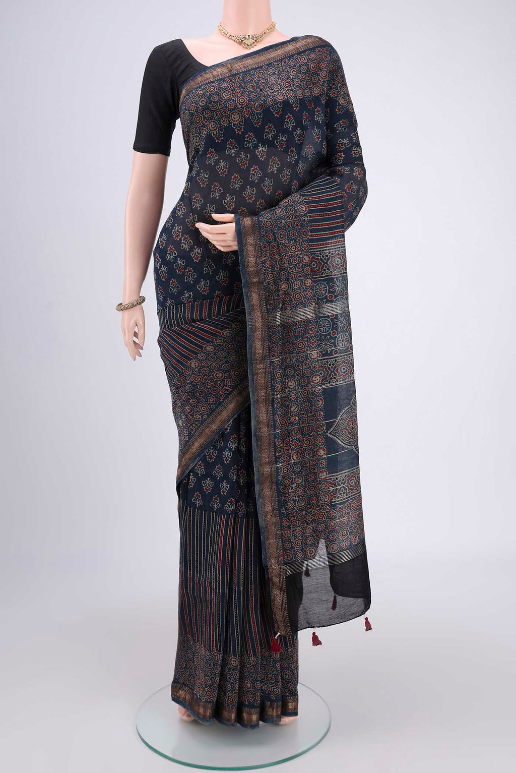 Indigo Chanderi Silk Cotton Saree with Ajrakh Print on the body and Zari Border.  displayed on a mannequin