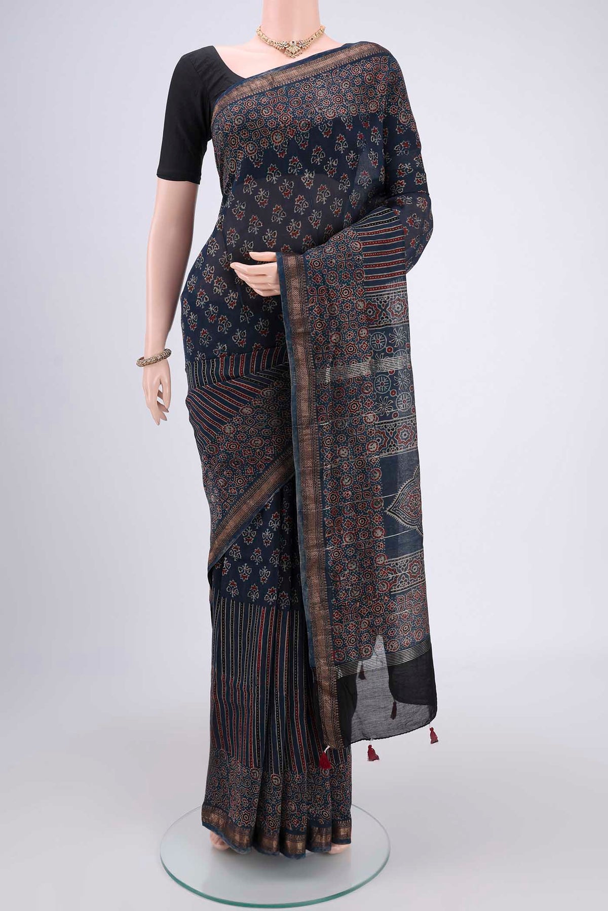Indigo Chanderi Silk Cotton Saree with Ajrakh Print on the body and Zari Border.  displayed on a mannequin