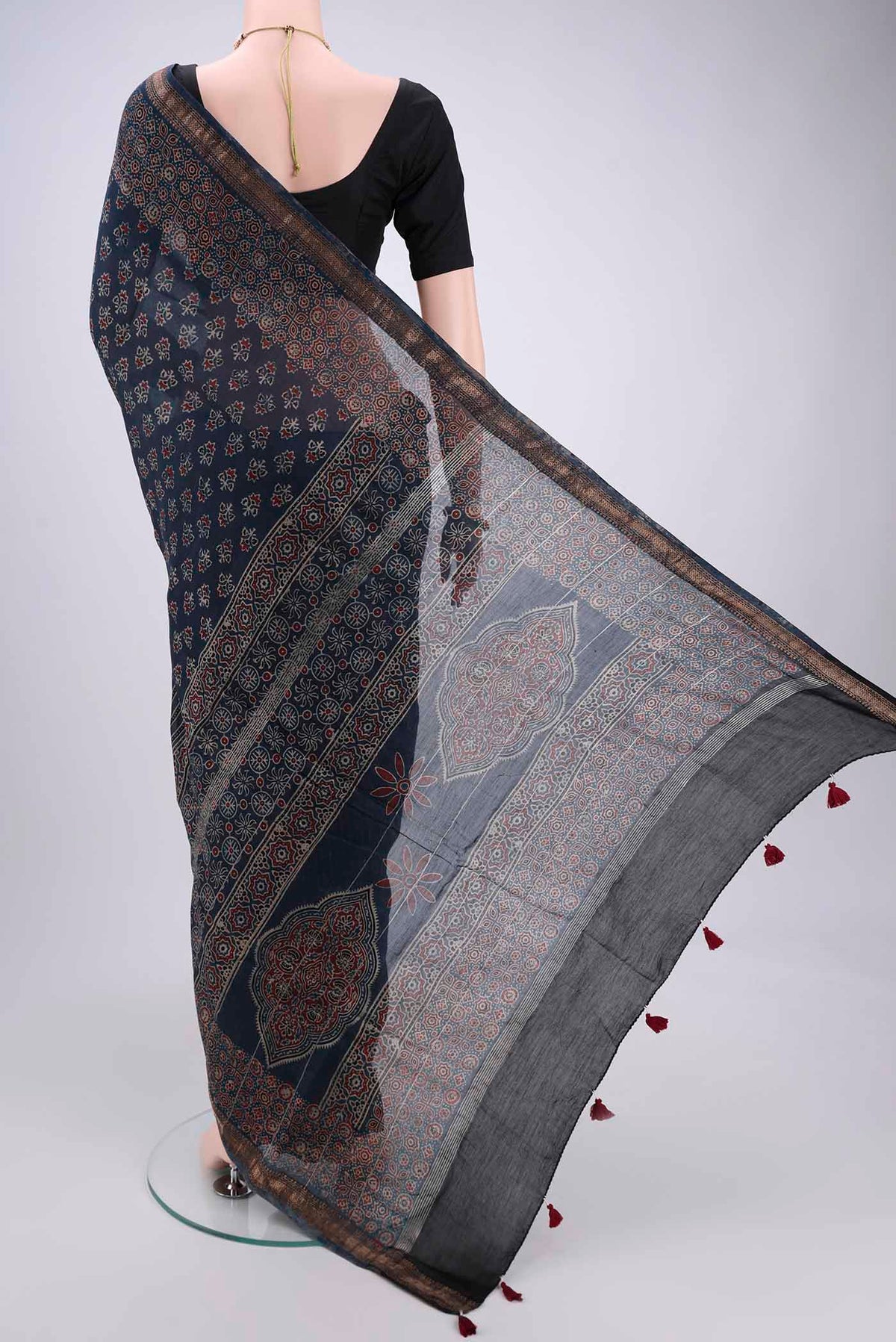 Flat view of Indigo Chanderi Silk Cotton Saree with Ajrakh Print on the body and Zari Border. 