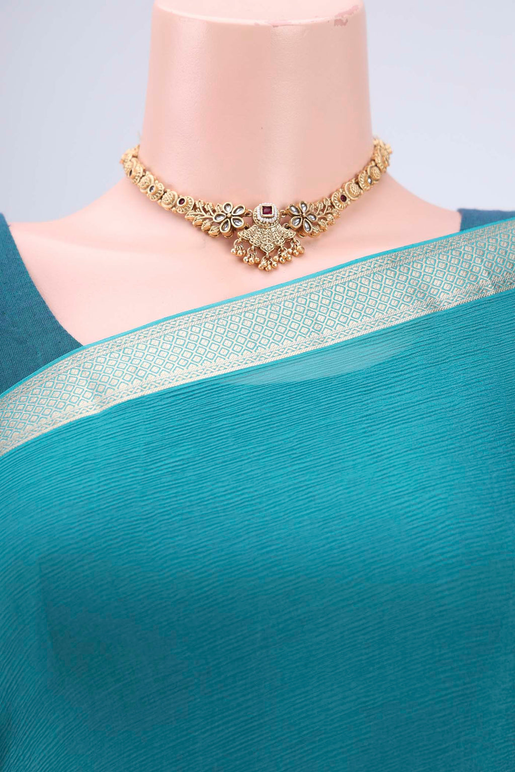 Border image of Peacock Blue Dual Tone Mysore Chiffon Saree with Plain Body and Zari Border. 