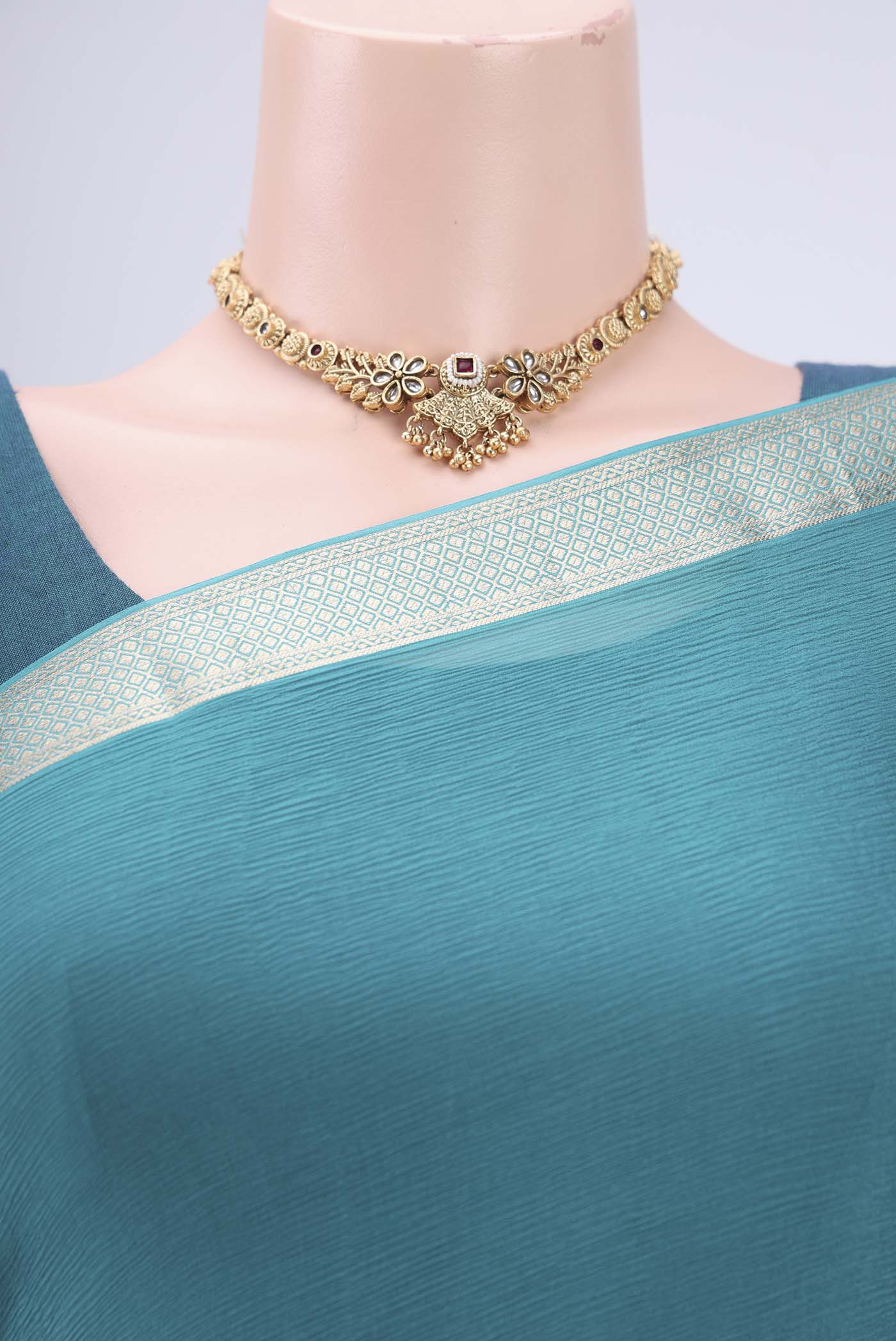 Border image of Peacock Blue Dual Tone Mysore Chiffon Saree with Plain Body and Zari Border. 