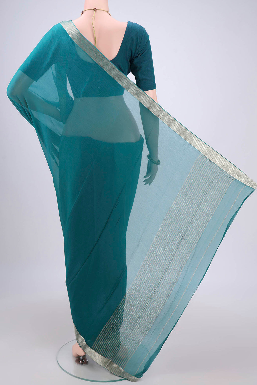 Flat view of Peacock Blue Dual Tone Mysore Chiffon Saree with Plain Body and Zari Border. 