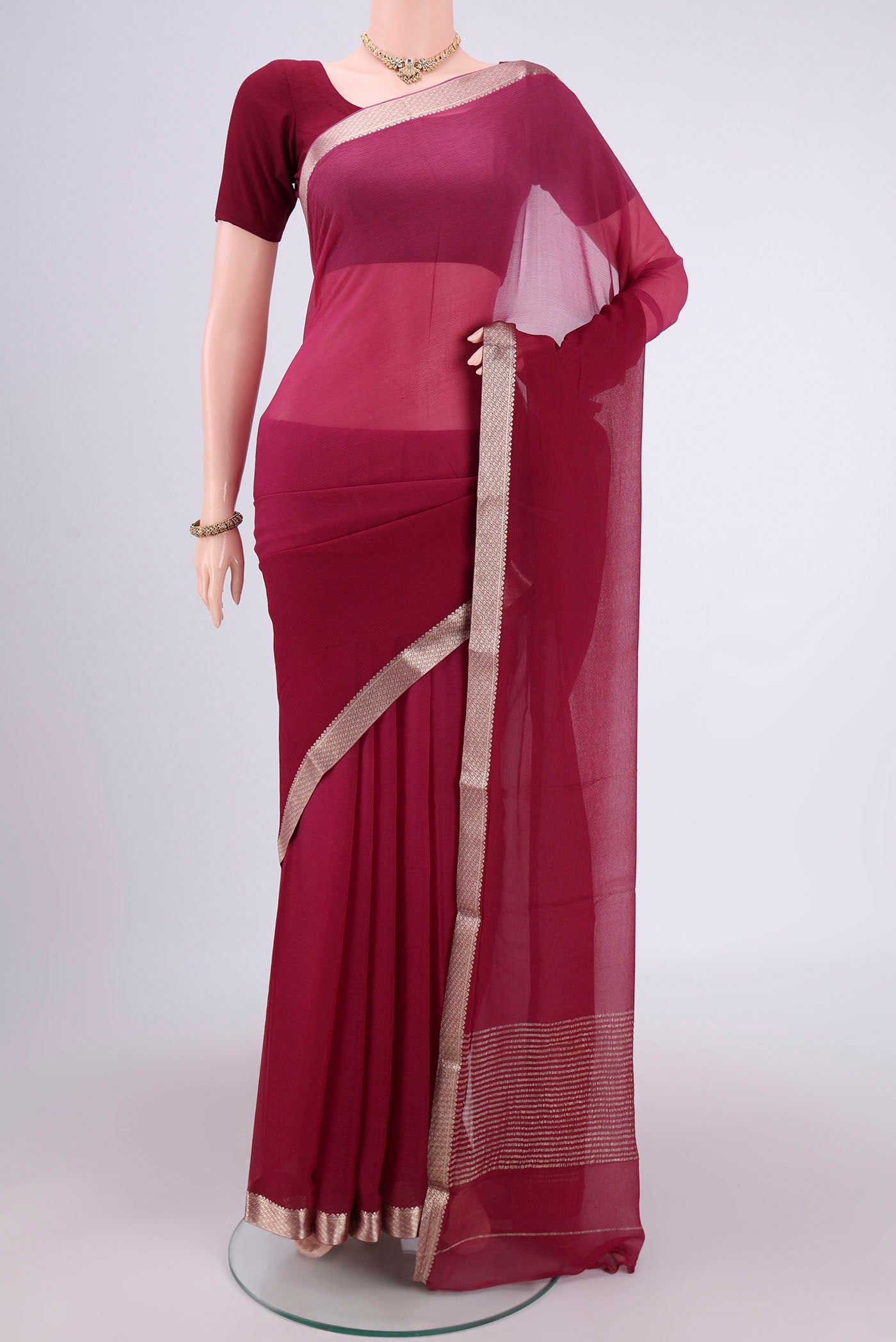 Magenta Dual Tone Mysore Chiffon Saree with Plain Body and Zari Border.  displayed on a mannequin