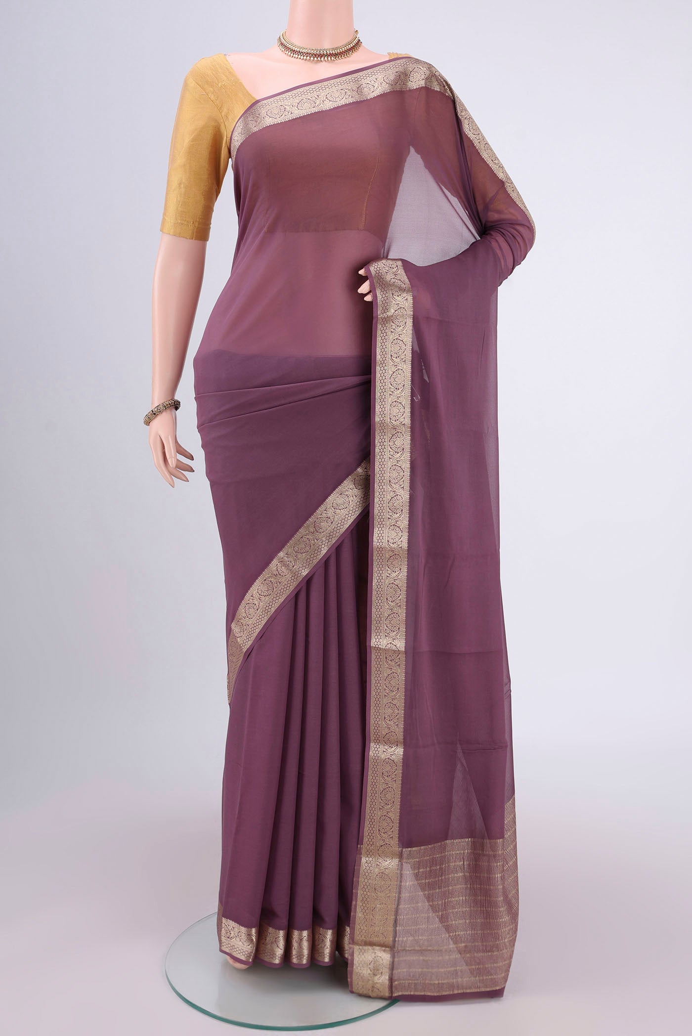 Mauve Dual Tone Mysore Georgette Saree with Plain Body and Zari Border.  displayed on a mannequin