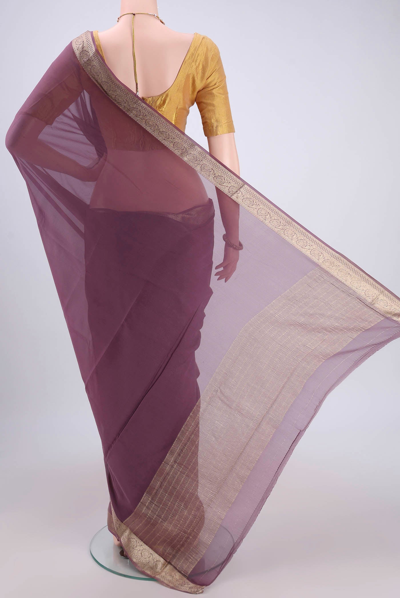 Flat view of Mauve Dual Tone Mysore Georgette Saree with Plain Body and Zari Border. 