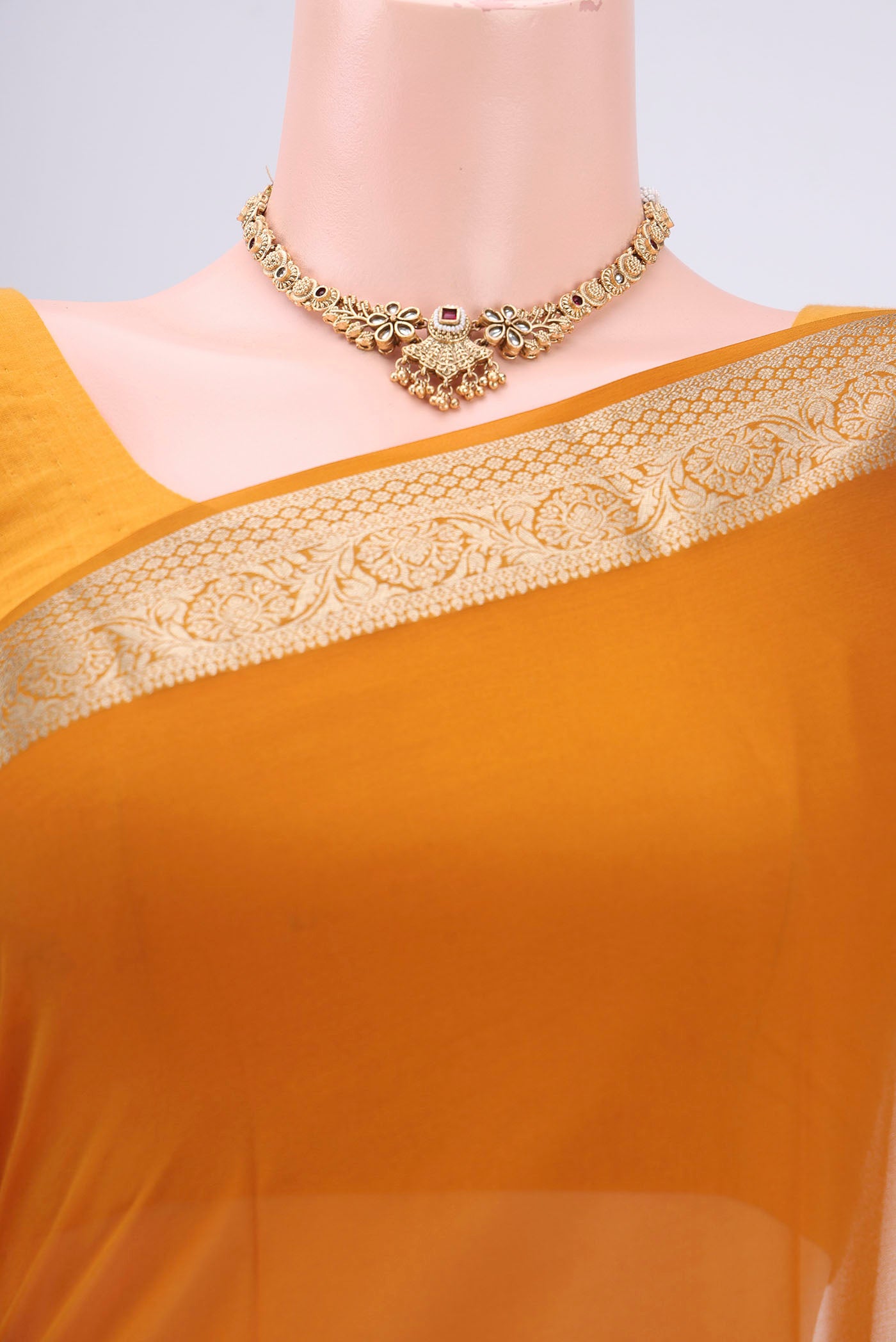 Border image of Mustard Georgette Saree with Plain Body and Satin Border. 
