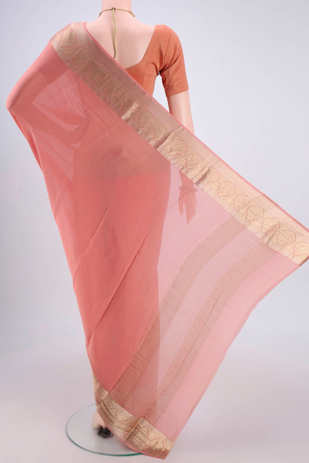 Flat view of Peach Mysore Chiffon Saree with Plain Body and Zari Border. 