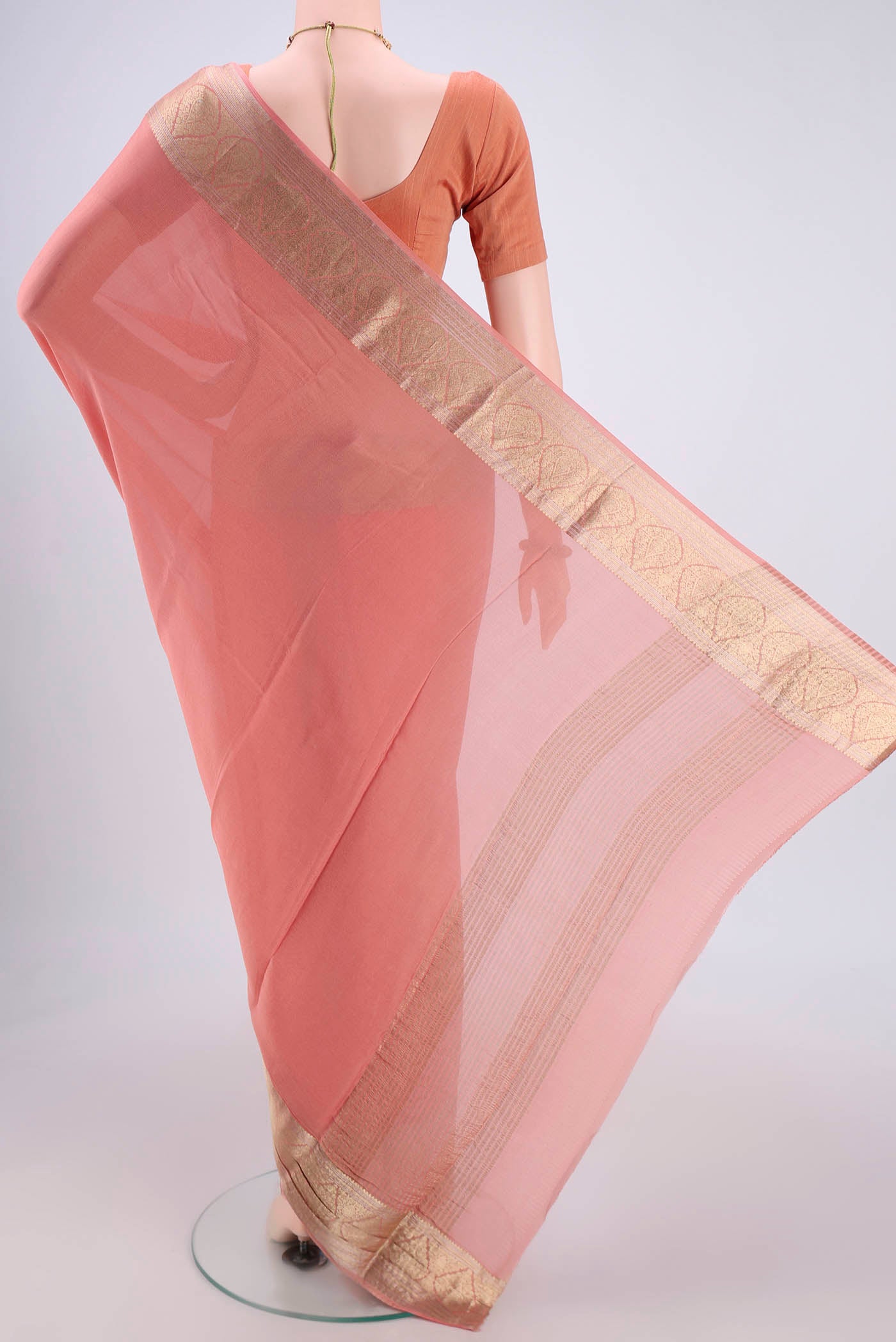 Flat view of Peach Mysore Chiffon Saree with Plain Body and Zari Border. 