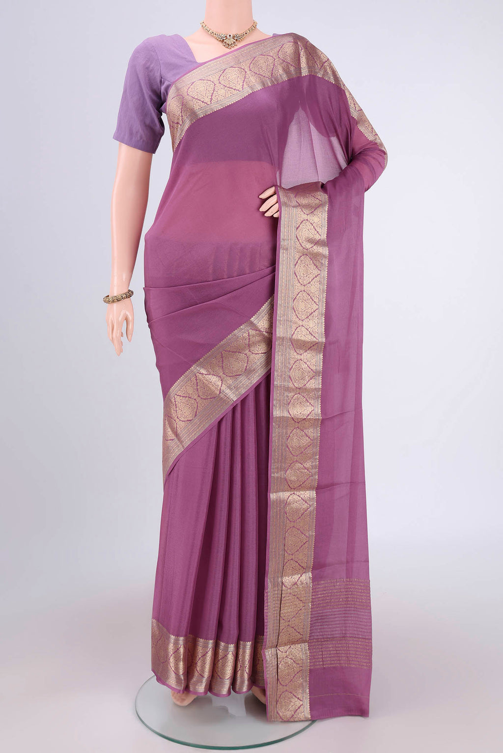 Lavender Mysore Chiffon Saree with Plain Body and Zari Border.  displayed on a mannequin