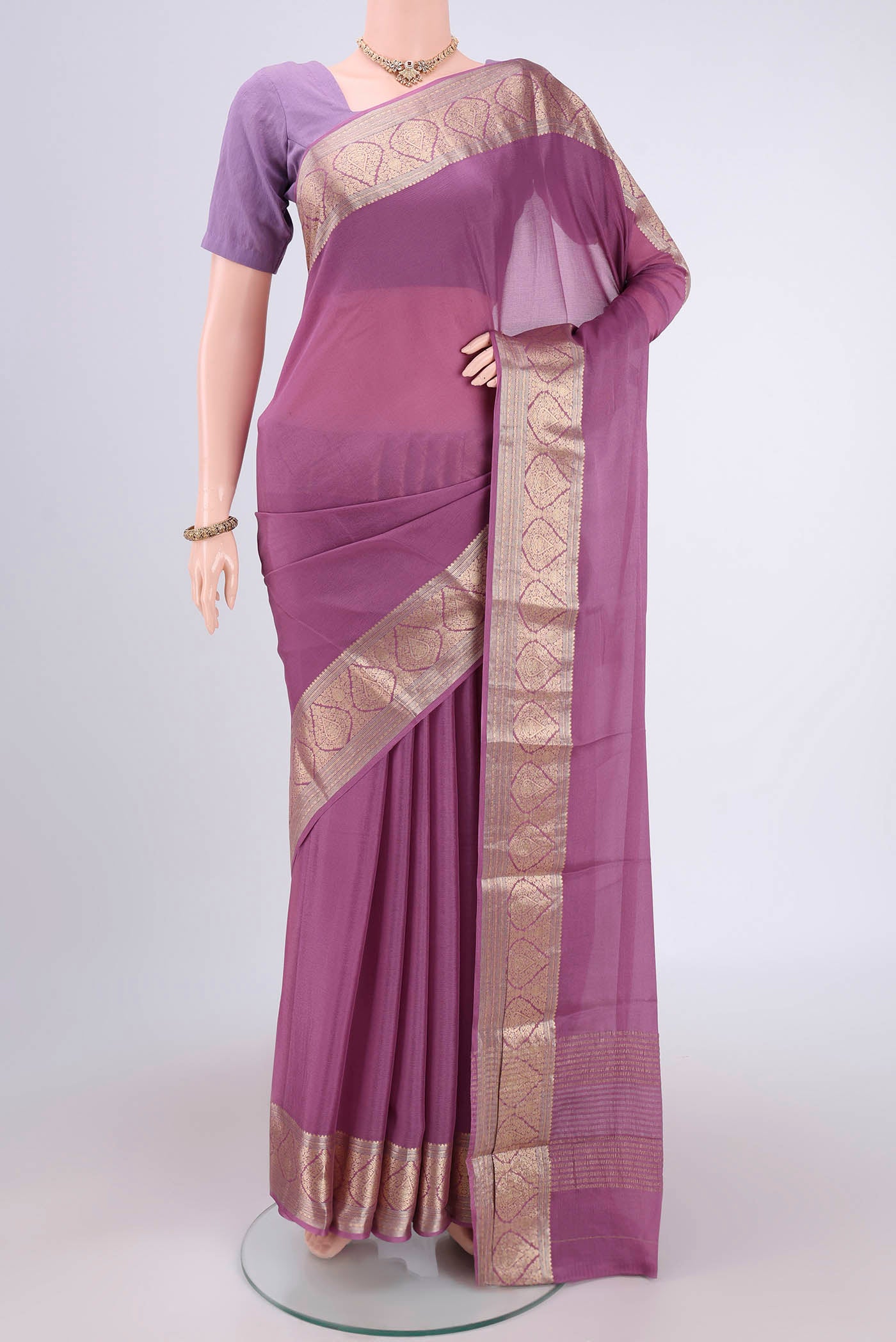 Lavender Mysore Chiffon Saree with Plain Body and Zari Border.  displayed on a mannequin